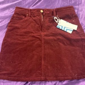 Burgundy corduroy skirt size 4. Button and zipper. Pockets. NWT